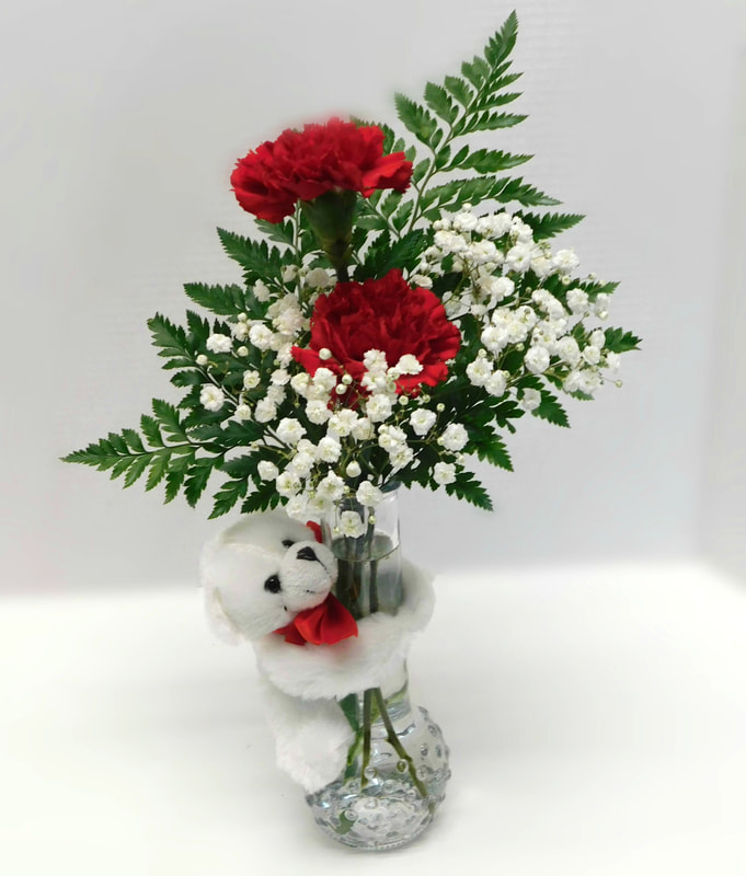 SWEET TREATS SPECIAL ​VDAY-103 $19.95 THREE CARNATIONS WITH GREENS AND BABY'S BREATH IN ​VASE WITH SUCKER
